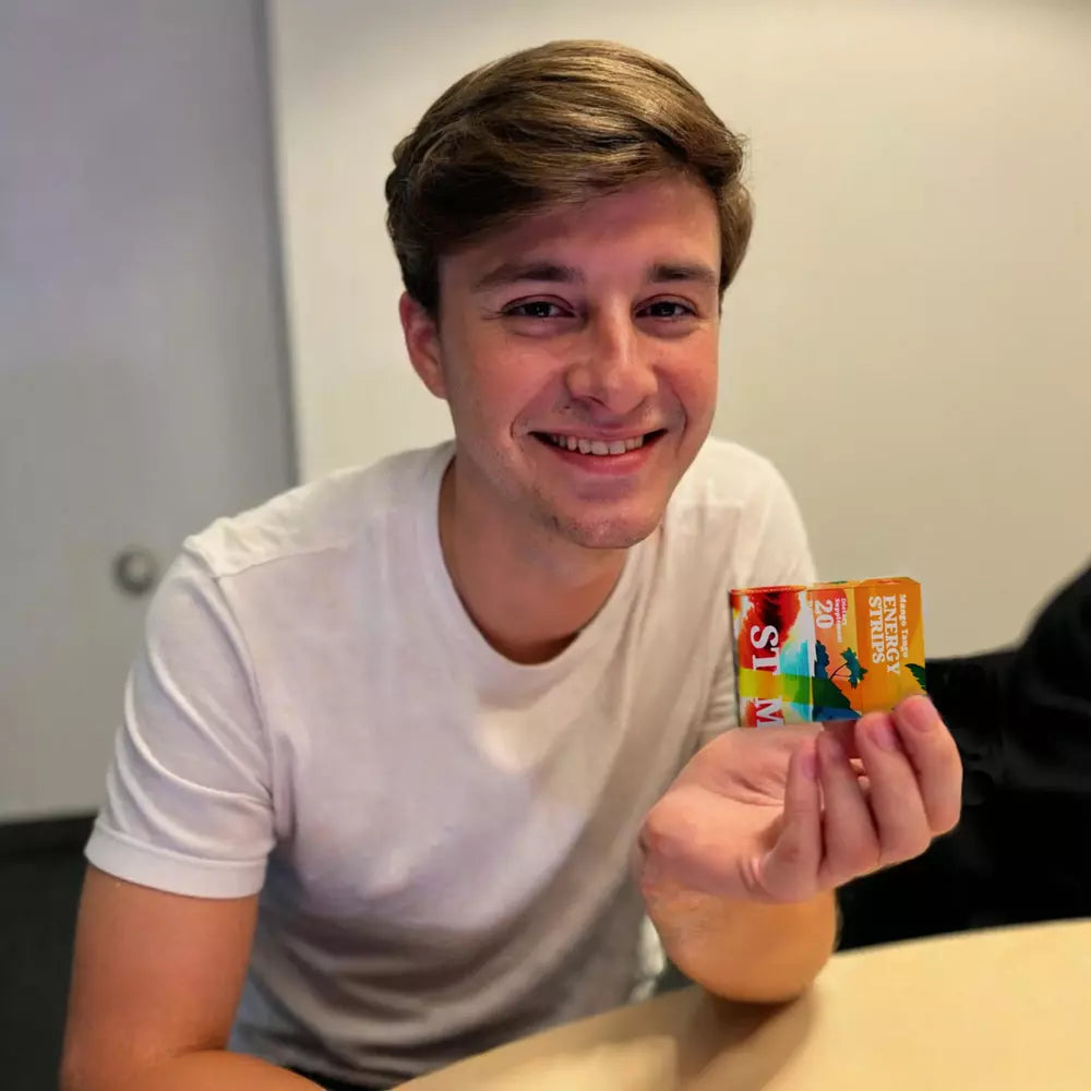 Image of a student holding a STIM Mango Tango pack