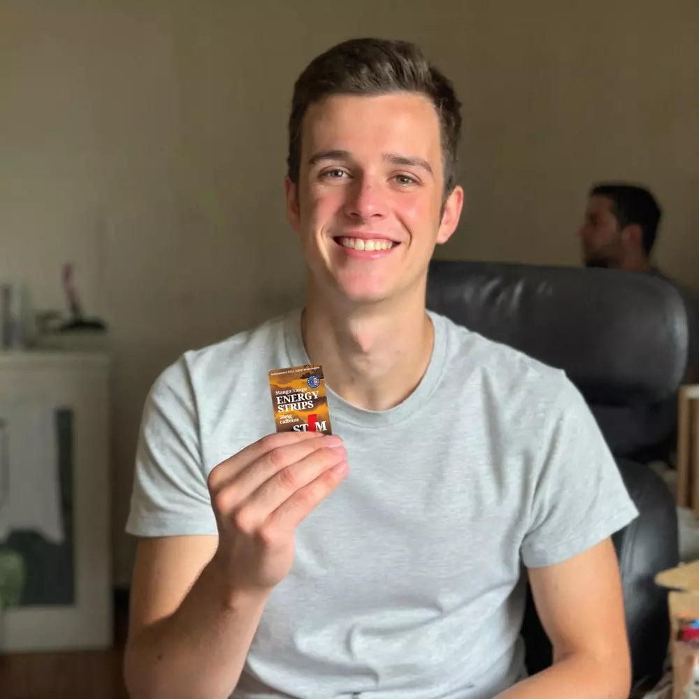 Image of  man holding a STIM Mango Tango strip in the office